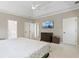 Serene main bedroom features tray ceiling, carpet, and a TV for relaxation at 533 Coolsprings Walk, Woodstock, GA 30188