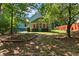 View of the screened porch with surrounding trees providing shade and privacy at 533 Coolsprings Walk, Woodstock, GA 30188