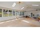 Open-concept sunroom with natural light and backyard access at 533 Coolsprings Walk, Woodstock, GA 30188