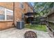 Cozy backyard featuring a small lawn, patio, and privacy fence, perfect for outdoor relaxation at 115 Winding River Dr # B, Atlanta, GA 30350