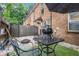 Backyard patio with room for grilling and outdoor entertaining on an artificial lawn at 115 Winding River Dr # B, Atlanta, GA 30350