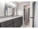 Stylish bathroom featuring a granite countertop, an undermount sink, and a walk-in shower at 115 Winding River Dr # B, Atlanta, GA 30350
