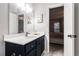 A bathroom features a white countertop vanity and a view into the bedroom at 115 Winding River Dr # B, Atlanta, GA 30350