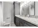 Stylish bathroom with a gray granite countertop, under mount sink and modern fixtures at 115 Winding River Dr # B, Atlanta, GA 30350