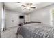 The Primary bedroom features carpet floors, a ceiling fan, and double closets at 115 Winding River Dr # B, Atlanta, GA 30350