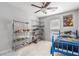 Well-lit bedroom showcasing ample storage, a ceiling fan and bright natural light at 115 Winding River Dr # B, Atlanta, GA 30350