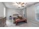 The Primary bedroom includes a ceiling fan and a queen-sized bed with a bench at 115 Winding River Dr # B, Atlanta, GA 30350