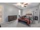 The Primary bedroom includes a ceiling fan and a queen-sized bed with a bench at 115 Winding River Dr # B, Atlanta, GA 30350