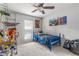 Bright bedroom features ceiling fan and natural light coming from the window at 115 Winding River Dr # B, Atlanta, GA 30350