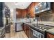A modern kitchen features stainless steel appliances, granite countertops, and wood cabinets at 115 Winding River Dr # B, Atlanta, GA 30350