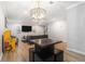 Open-concept living room offers modern lighting, stylish seating, and seamless flow for easy entertaining at 115 Winding River Dr # B, Atlanta, GA 30350