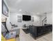 Inviting living room with stylish furniture, a modern TV, and a retro arcade game at 115 Winding River Dr # B, Atlanta, GA 30350
