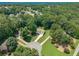 Aerial view of home surrounded by mature trees in a residential neighborhood at 3275 Cherry Oak Ln, Cumming, GA 30041