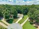 Aerial view of charming suburban home with lush green lawn at 3275 Cherry Oak Ln, Cumming, GA 30041