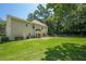 Expansive backyard with lush green lawn, bordered by mature trees, offering privacy at 3275 Cherry Oak Ln, Cumming, GA 30041