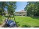 Large grassy backyard with room for a swing set and bordered by mature trees at 3275 Cherry Oak Ln, Cumming, GA 30041