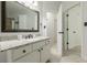 Bathroom with granite countertop and white vanity, next to hallways leading to other rooms at 3275 Cherry Oak Ln, Cumming, GA 30041