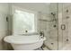 Bathroom features a standalone tub and a glass-enclosed walk-in shower at 3275 Cherry Oak Ln, Cumming, GA 30041