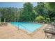 Large community pool with ample seating for residents to relax and enjoy at 3275 Cherry Oak Ln, Cumming, GA 30041