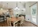 Dining area with large windows offering abundant natural light and views to the backyard at 3275 Cherry Oak Ln, Cumming, GA 30041