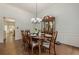 Formal dining room featuring hardwood floors, decorative chandelier, and classic china cabinet at 3275 Cherry Oak Ln, Cumming, GA 30041
