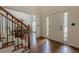 Inviting foyer with hardwood floors and staircase leading to the second floor at 3275 Cherry Oak Ln, Cumming, GA 30041