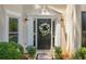 Close-up of a home's front door framed with sidelights and decorative floral wreath at 3275 Cherry Oak Ln, Cumming, GA 30041