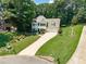 Lovely home with lush front yard, two-car garage, and well-maintained landscaping at 3275 Cherry Oak Ln, Cumming, GA 30041