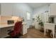 Functional laundry room includes a sink, desk, and ample cabinet space at 3275 Cherry Oak Ln, Cumming, GA 30041