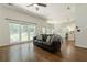 Bright living room features hardwood floors, large windows, and an open layout at 3275 Cherry Oak Ln, Cumming, GA 30041