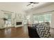 Bright living room with fireplace and windows overlooking the backyard at 3275 Cherry Oak Ln, Cumming, GA 30041