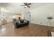 Open concept living room with hardwood floors, and a view of the dining area at 3275 Cherry Oak Ln, Cumming, GA 30041