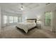 Spacious main bedroom with a tray ceiling, natural light, and plush carpeting at 3275 Cherry Oak Ln, Cumming, GA 30041