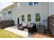 Backyard patio with an outdoor seating area, barbecue and privacy fence at 3374 Verdi Ln, Kennesaw, GA 30144