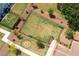 Aerial view of fenced community dog park with seating and a fire pit area at 3374 Verdi Ln, Kennesaw, GA 30144