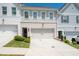 Beautiful townhome with a two-car garage, brick accents, and well-manicured landscaping at 3374 Verdi Ln, Kennesaw, GA 30144