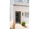Close-up of the front door featuring neutral paint, brickwork, and a house number at 3374 Verdi Ln, Kennesaw, GA 30144