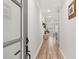 Inviting hallway showcasing hardwood floors, neutral walls, and elegant decorative touches at 3374 Verdi Ln, Kennesaw, GA 30144