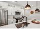 Stylish kitchen with a center island, stainless steel appliances, and subway tile backsplash at 3374 Verdi Ln, Kennesaw, GA 30144