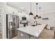 Modern kitchen featuring stainless steel appliances, granite countertops, and ample cabinet space at 3374 Verdi Ln, Kennesaw, GA 30144