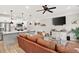 Open concept living room with view of the kitchen, breakfast bar, and stainless appliances at 3374 Verdi Ln, Kennesaw, GA 30144