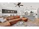 Open concept living room with view of the kitchen, breakfast bar, and dining area at 3374 Verdi Ln, Kennesaw, GA 30144