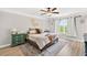 Comfortable bedroom featuring neutral walls, light wood flooring, and a ceiling fan at 3374 Verdi Ln, Kennesaw, GA 30144