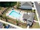Aerial view of community pool with lounge chairs and clubhouse at 3374 Verdi Ln, Kennesaw, GA 30144