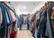 Walk-in closet filled with ample hanging storage space on both sides at 3374 Verdi Ln, Kennesaw, GA 30144