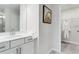 Well-lit bathroom features a vanity and access to a walk-in closet at 5846 Schelton Se Pl, Mableton, GA 30126