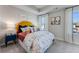 Bright bedroom features large windows, tray ceiling, and stylish decor at 5846 Schelton Se Pl, Mableton, GA 30126