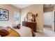 Tastefully decorated bedroom with a dresser, stylish mirror, and neutral color scheme at 5846 Schelton Se Pl, Mableton, GA 30126