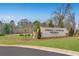Community entrance sign with landscaping and manicured lawns at 5846 Schelton Se Pl, Mableton, GA 30126