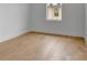 Bright bedroom with a window, hardwood floors and white walls at 150 Rolison Way, Fayetteville, GA 30214